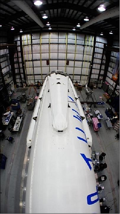 Figure 26: All four landing legs are mounted on Falcon-9 rocket being processed inside a hanger at Cape Canaveral, FL for a March launch (image credit: SpaceX)