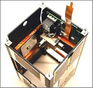 Figure 9: Photo showing the X- and Y-axis torque coils mounted in the PSSCT-2 body; the mounted reaction wheel assembly and IMU is also shown (image credit: The Aerospace Corporation)