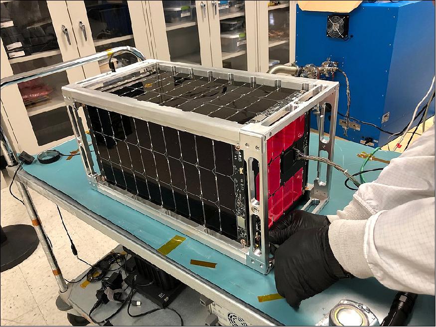 Figure 1: Photo of the El Camino Real 16U CubeSat during "glow" testing of its solar cells (image credit: Momentus)