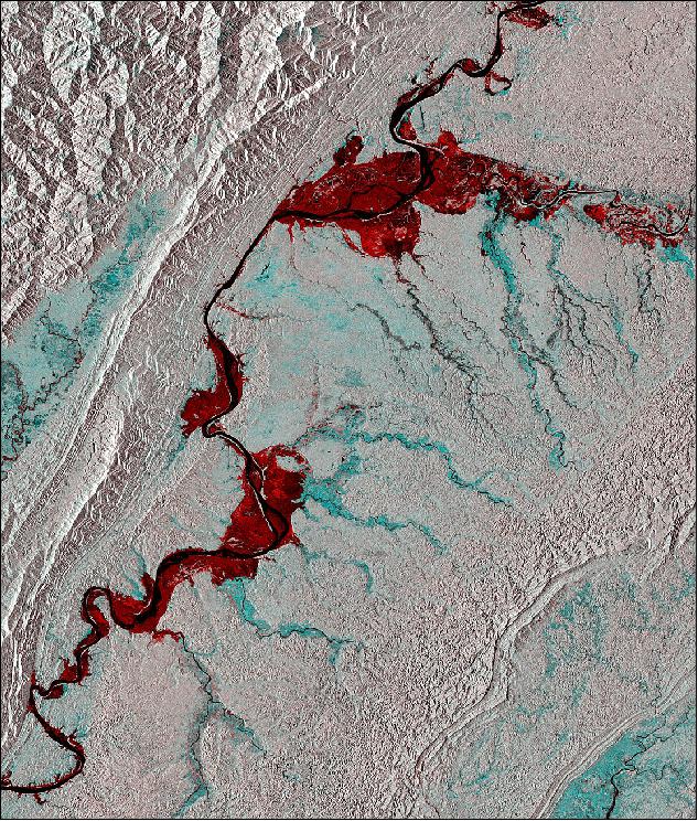 Figure 23: This image was created using two passes by Sentinel-1’s radar: one before the flooding on 20 March 2015 and the other during the event on 4 September 2015. Combining them shows changes between the images, such as the inundation of some 111,000 hectares of land on either sides of the river bank appearing in red (image credit: ESA, the image contains modified Copernicus Sentinel data (2015), processed by ESA, CC BY-SA 3.0 IGO)
