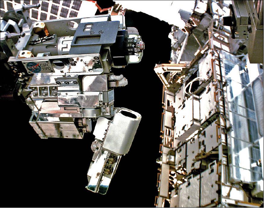 Figure 2: Robotic Refueling Mission 3's Multi-Function Tool 2, operated by Dextre, demonstrates robotic refueling operations on the outside of space station (image credit: NASA)
