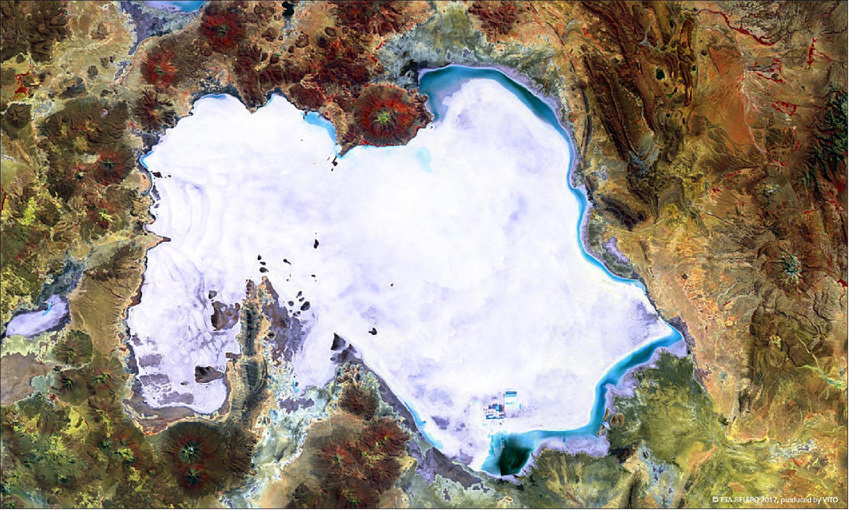 Figure 36: The false-color PROBA-V image was acquired on 5 April 2017. On the western side of the Salar de Uyuni, some wavy patterns are visible, while blue shades on the northern and eastern edges indicate flooded areas. The small rectangular patches to the south of the salt flat indicate a large lithium mining area (image credit: ESA/Belspo – produced by VITO)