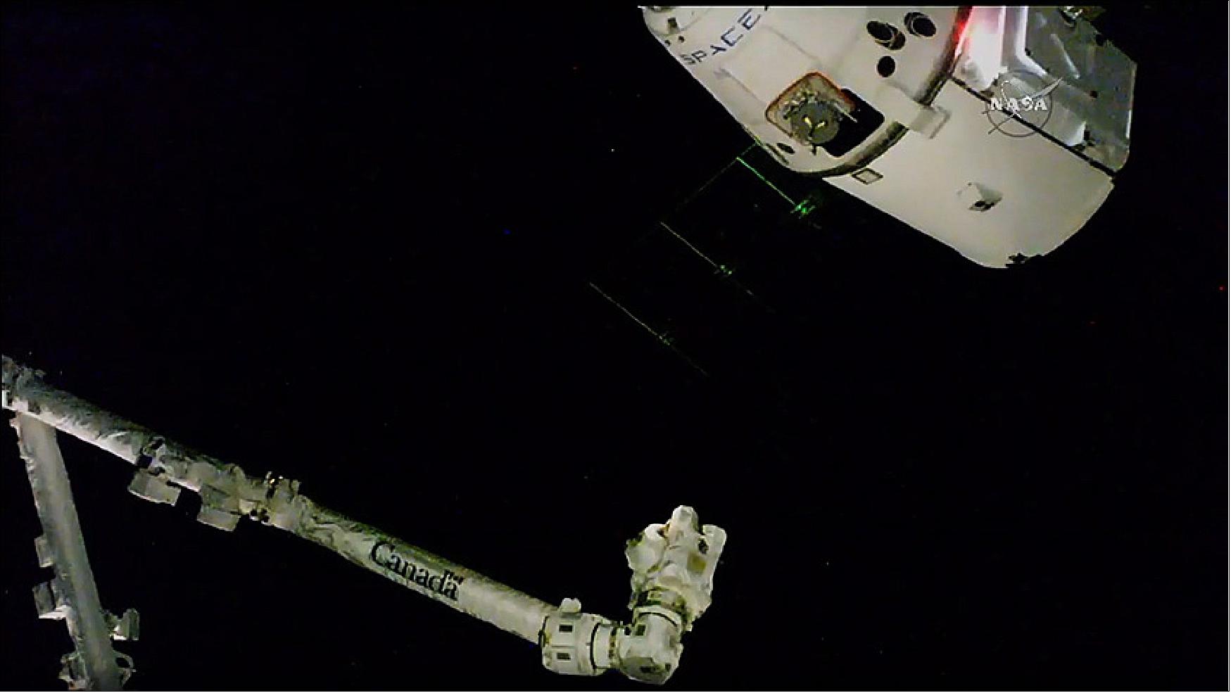 Figure 13: The Dragon resupply ship is pictured just 10 meters away from the space station’s Canadarm2 (image credit: NASA TV)