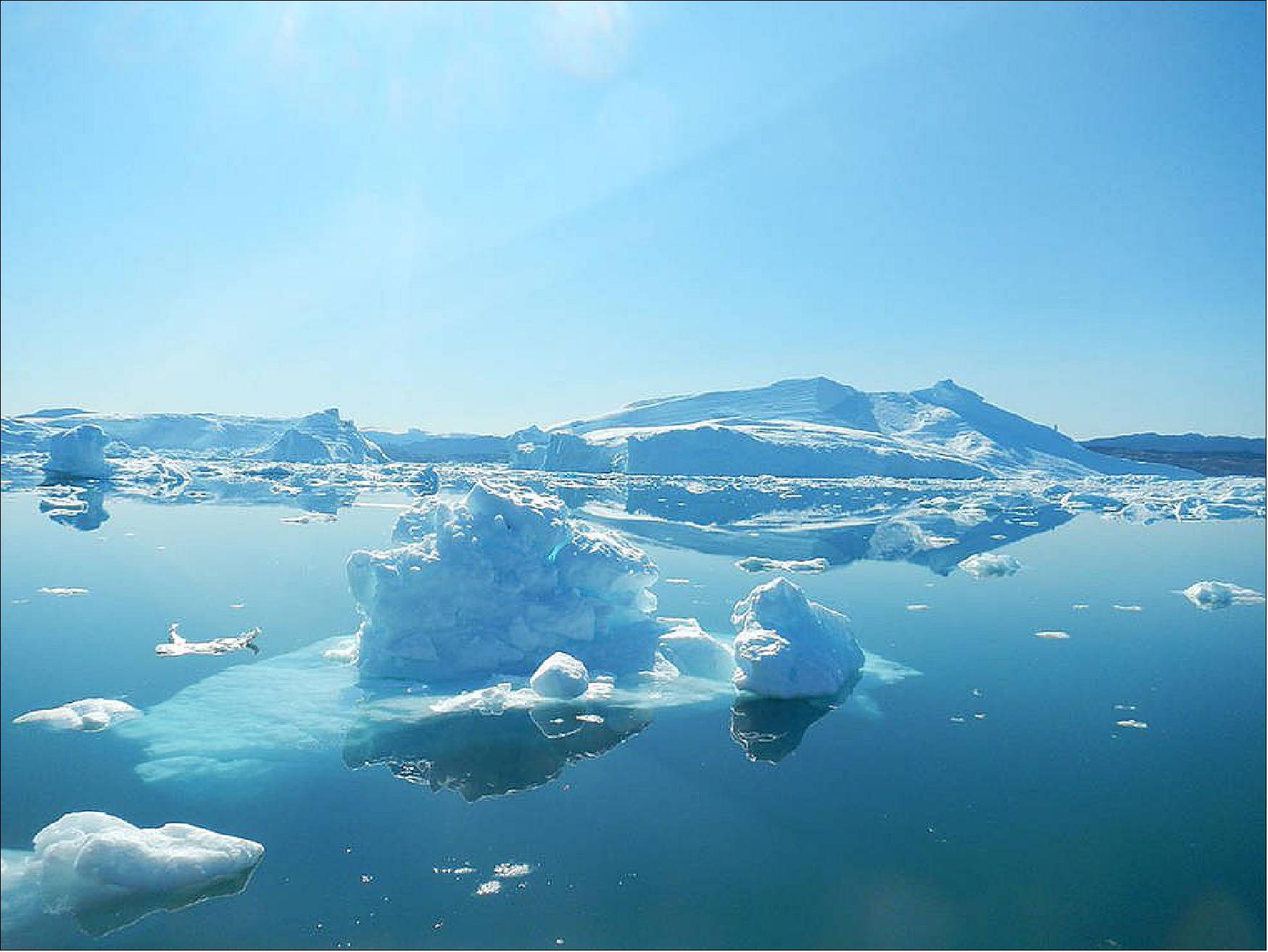 Figure 14: Warmer ocean waters are speeding up the rate at which Greenland's glaciers are melting and calving, or breaking off to form icebergs. This is causing the glaciers to retreat toward land, hastening the loss of ice from Greenland’s Ice Sheet (image credit: NASA/JPL-Caltech)