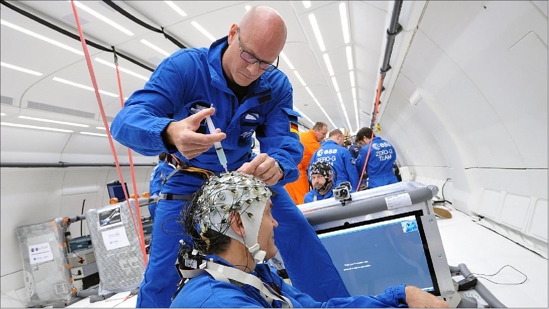Figure 41: Photo showing the preparations for a human physiology experiment for a parabolic flight (image credit: DLR)