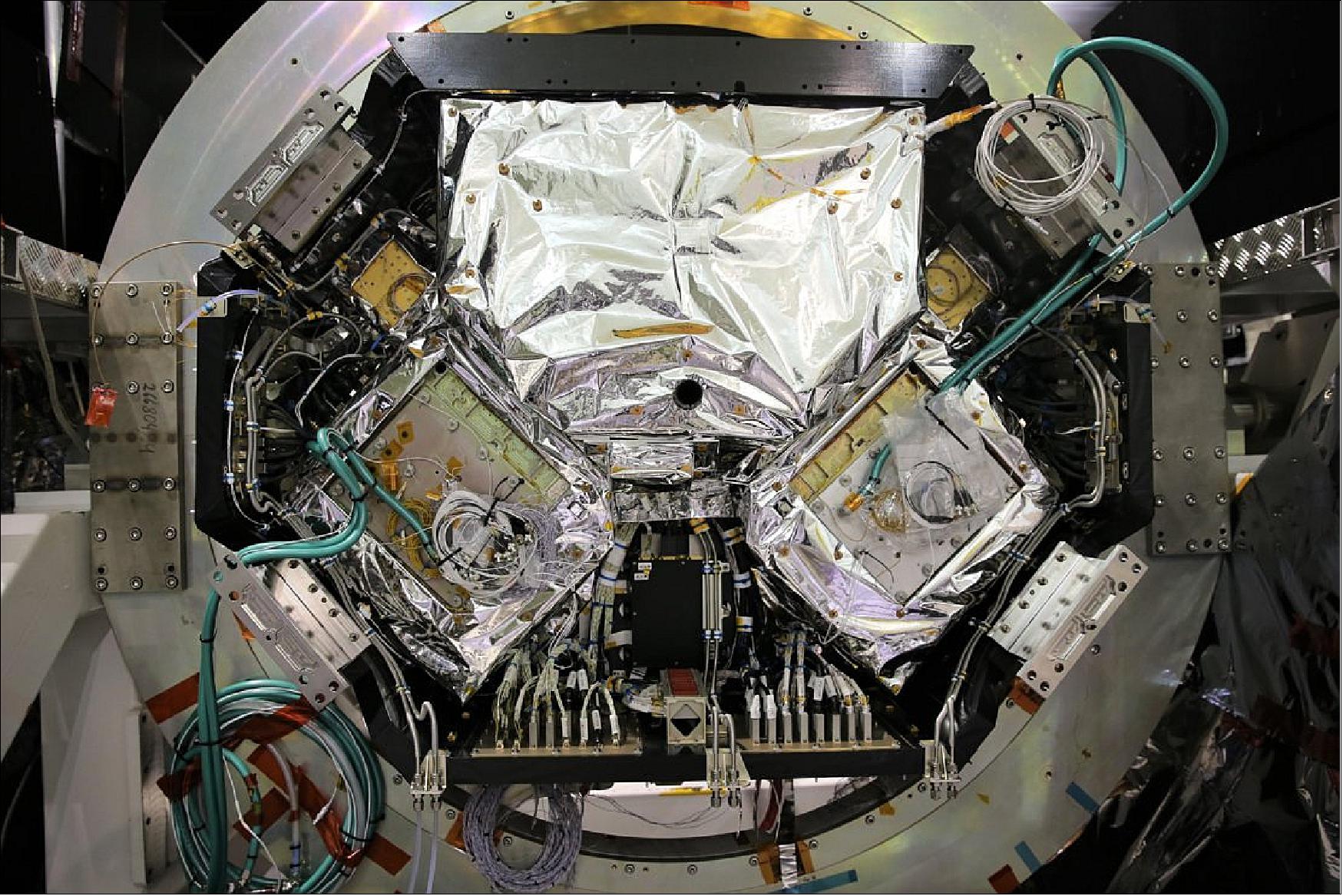 Figure 36: This photo, which was taken in the cleanroom when Aeolus was being built, shows the instrument's two lasers. They are the two large square plate-like items in the middle. Aeolus carries the world's first space Doppler wind lidar. It works by emitting short, powerful pulses of ultraviolet light from a laser and measures the Doppler shift from the very small amount of light that is scattered back to the instrument from molecules and particles in the atmosphere to deliver vertical profiles that show the speed of the world's winds in the lowermost 30 km of the atmosphere (image credit: Airbus Defence and Space)