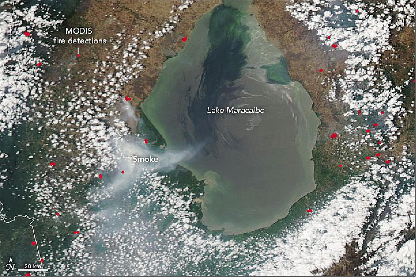 Figure 80: On March 27, 2020, the MODIS instrument on NASA's Aqua satellite acquired an image of a sizable smoke plume over the park. Places where the sensor detected unusually warm temperatures—signs of fires—are shown with red. As seen in the image of Figure 81, the fire was still smoldering in late-April (image credit: NASA Earth Observatory, images by Lauren Dauphin, using MODIS data from NASA EOSDIS/LANCE and GIBS/Worldview)
