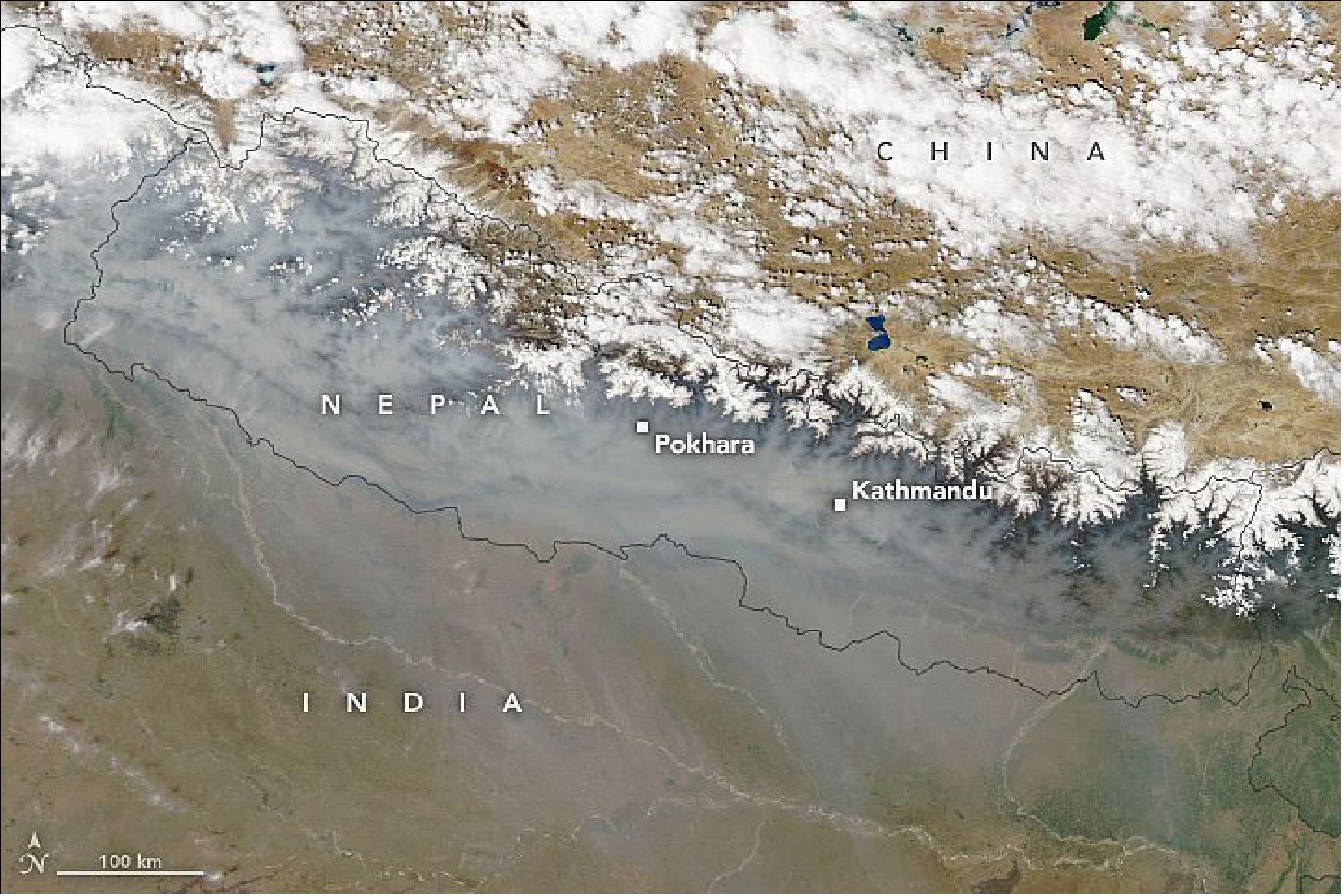 Figure 41: After an unusually dry winter, forest fires have raged throughout the mountainous country. Scientists have used several satellite sensors to track Nepal’s active 2021 fire season. The MODIS instrument on NASA’s Aqua satellite acquired this natural-color image of smoke enveloping much of the mountainous country on April 5, 2021. Most of the blazes have occurred in lower-elevation areas in southern Nepal, while the Himalayas serve as a barrier that directs smoke east toward India and Bangladesh rather than north into China (image credit: NASA Earth Observatory images by Lauren Dauphin, using MODIS data from NASA EOSDIS LANCE and GIBS/Worldview. Story by Adam Voiland)