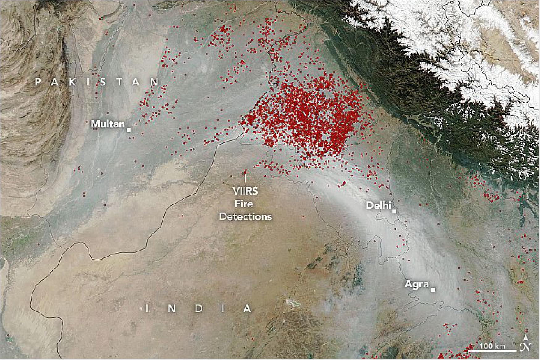 Figure 4: On November 11, 2021, the Visible Infrared Imaging Radiometer Suite (VIIRS) on the Suomi NPP satellite acquired this natural-color image of a river of smoke streaming from fires in Punjab and Haryana toward Delhi, one of India’s most populous cities. Use the image comparison slider to see the locations of hotspots observed by VIIRS that afternoon. Fires in northern Pakistan likely contributed some of the smoke as well (image credit: NASA Earth Observatory)