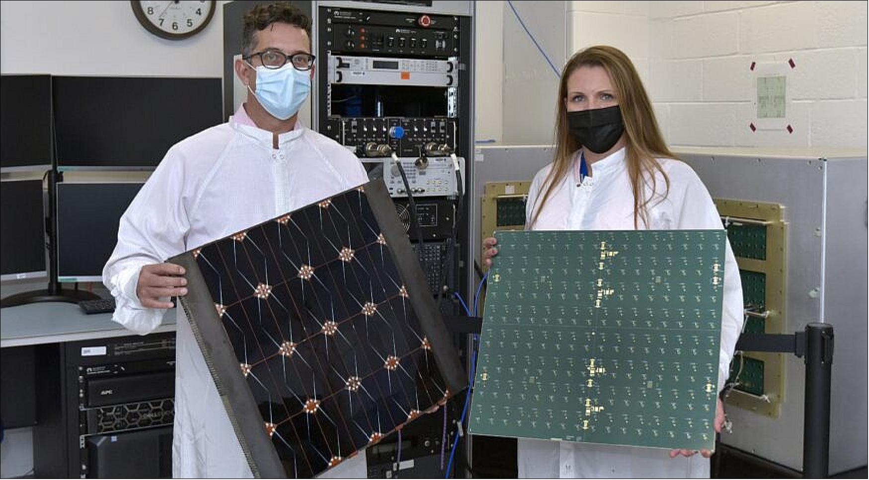 Figure 6: Project managers James Winter (Air Force Research Laboratory) and Tara Theret (Northrop Grumman) hold models of the photovoltaic and the radio frequency sides of the sandwich tile that converts solar energy to radio-frequency power (image credit: Northrop Grumman)