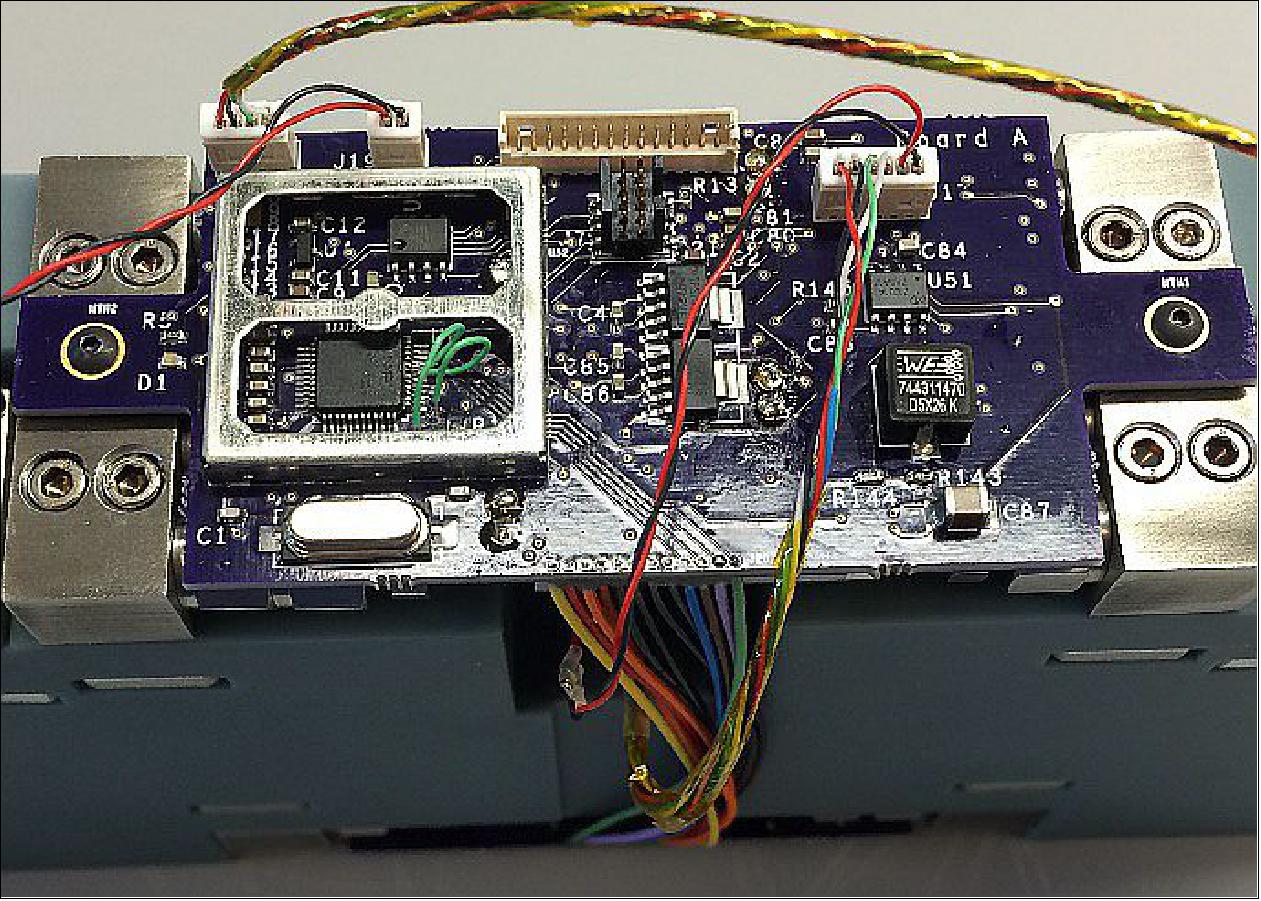 Figure 6: Circuit board, mounted to the thruster. The microcontroller is located in the RF shield (left, cover removed), image credit: Georgia Tech)