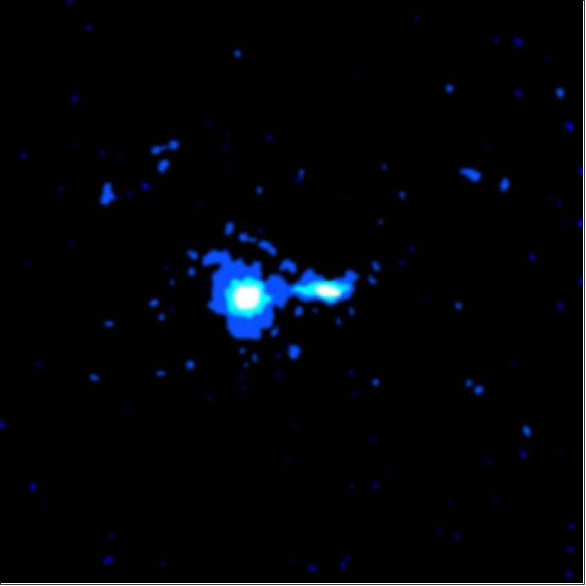 Figure 57: PKS 0637-752 is so distant that we see it as it was 6 billion years ago. It is a luminous quasar that radiates with the power of 10 trillion suns from a region smaller than our solar system. The source of this prodigious energy is believed to be a supermassive black hole.The X-ray jet observed for the first time by Chandra in PKS 0637-752, is a dramatic example of a cosmic jet. It has blasted outward from the quasar into intergalactic space for a distance of at least 200,000 light years! The jet's presence means that electromagnetic forces are continually accelerating electrons to extremely high energies over enormous distances. Chandra observations, combined with radio observations, should provide insight into this important cosmic energy conversion process (image credit: NASA/CXC/SAO)