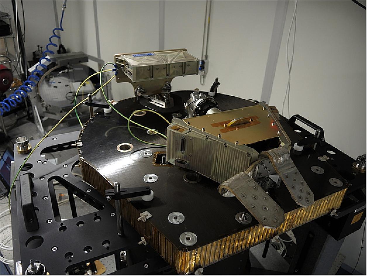 Figure 59: The bronze-colored FPM, which houses the CCD detector array and the Front-End Electronics, is seen here mounted on the flat, black optical bench at the rear of the downward-pointing telescope tube (not seen). The FPM is the detector system that captures the image from the telescope (image credit: University of Bern)