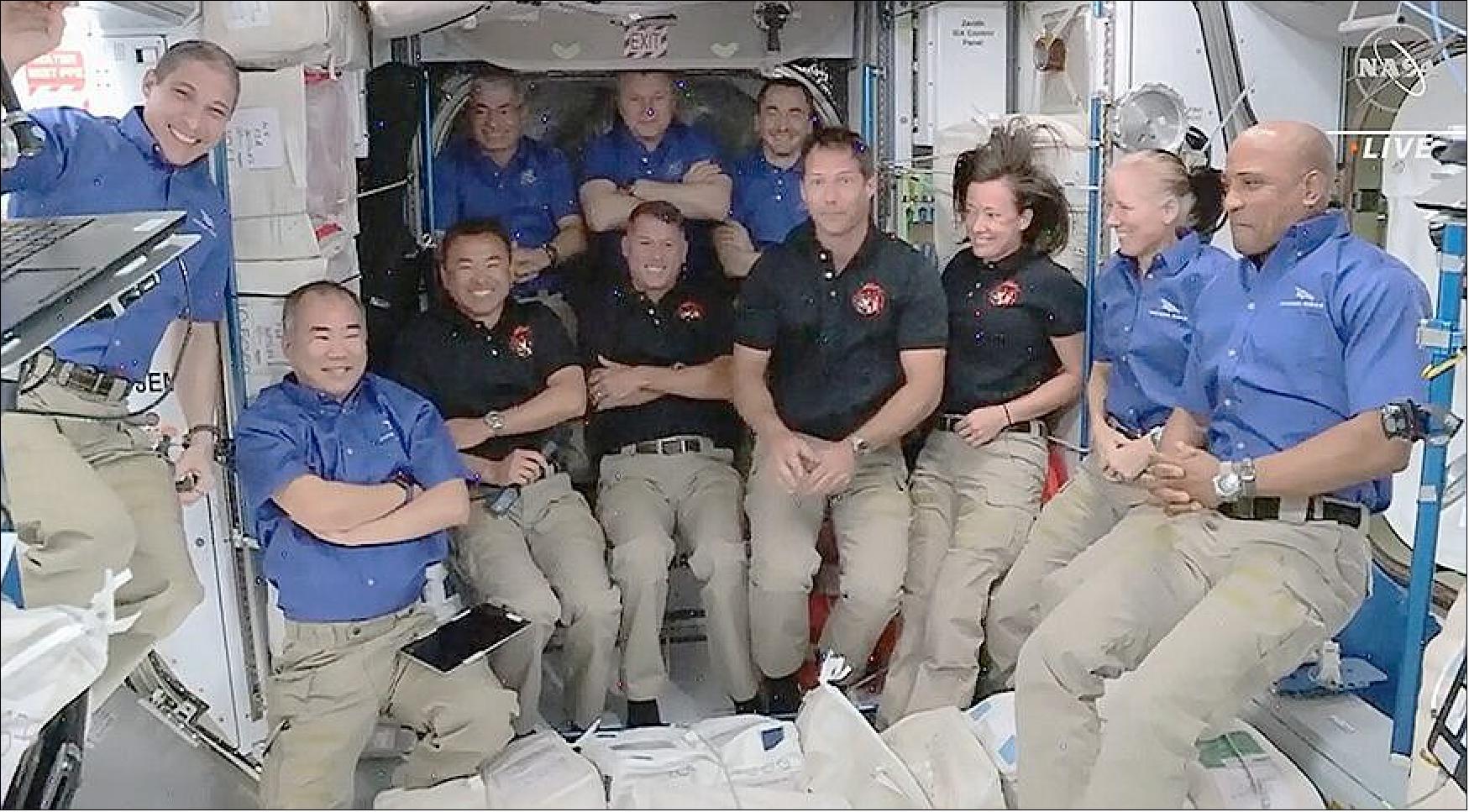 Figure 5: The four astronauts on the Crew-2 mission, in black shirts, join their colleagues on the International Space Station in ceremony just after the Crew Dragon Endeavour's arrival at the station April 24 (image credit: NASA TV)