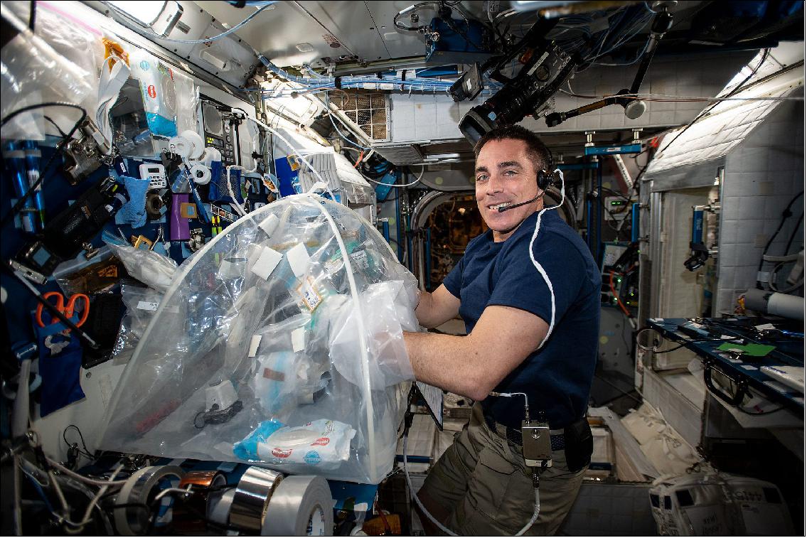 Figure 7: Former NASA astronaut Chris Cassidy processes biological samples in a glovebag aboard the International Space Station for the Food Physiology experiment to characterize the key effects of an enhanced spaceflight diet on immune function, the gut microbiome, and nutritional status indicators (image credit: NASA)