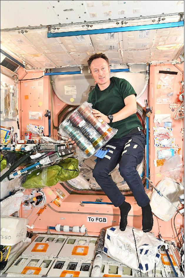 Figure 17: ESA astronaut Matthias Maurer holds a package of space food from Saarland on the ISS ahead of a Saint Nicholas feast with his crew mates in orbit (image credit: ESA)
