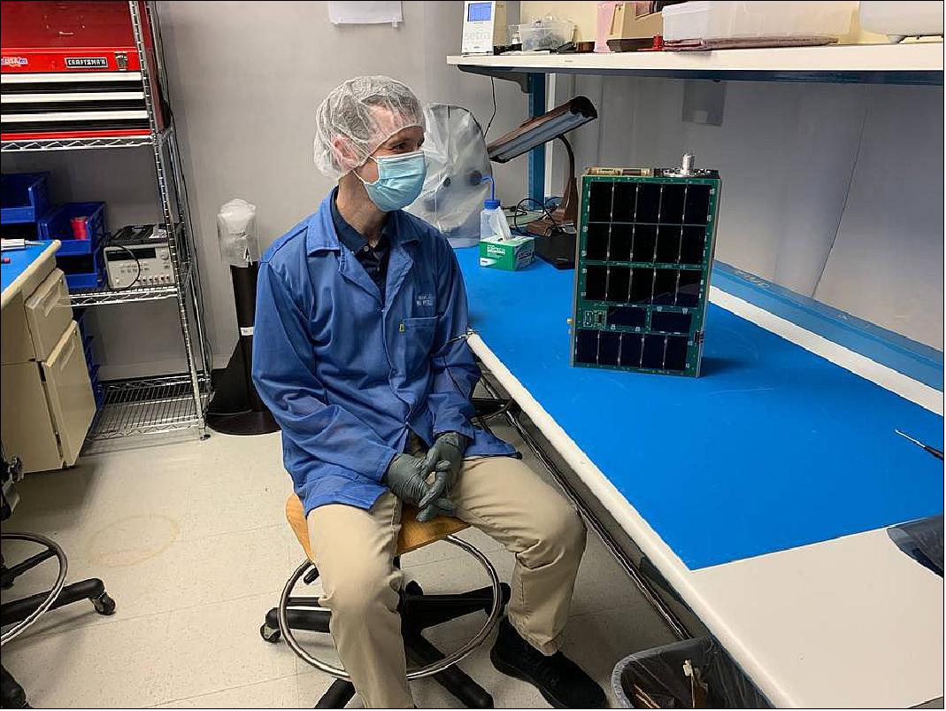 Figure 2: In the lab, CuPID Principal Investigator Brian Walsh admires the satellite in July 2021, the day before it left to meet the rocket deployer at Vandenberg Space Force Base in California (image credit: Emil Atz)