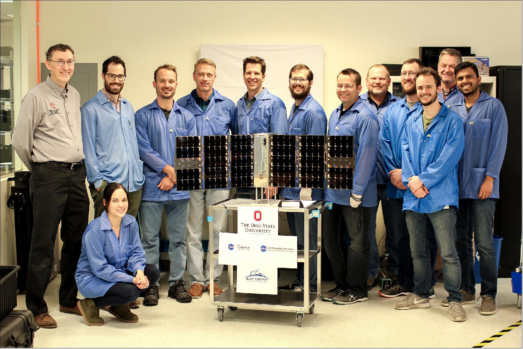 Figure 4: The CubeRRT satellite and Blue Canyon Technologies team members with Principal Investigator Joel Johnson (far left) of The Ohio State University (image credit: Blue Canyon Technologies) 7)