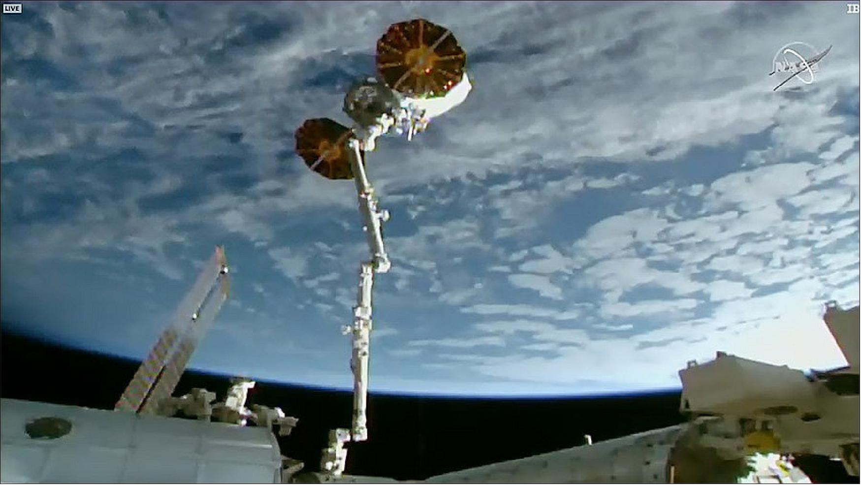 Figure 5: The Northrop Grumman Cygnus space freighter is in the grip of the Canadarm2 robotic arm moments before its release above the South Pacific Ocean (image credit: NASA TV)