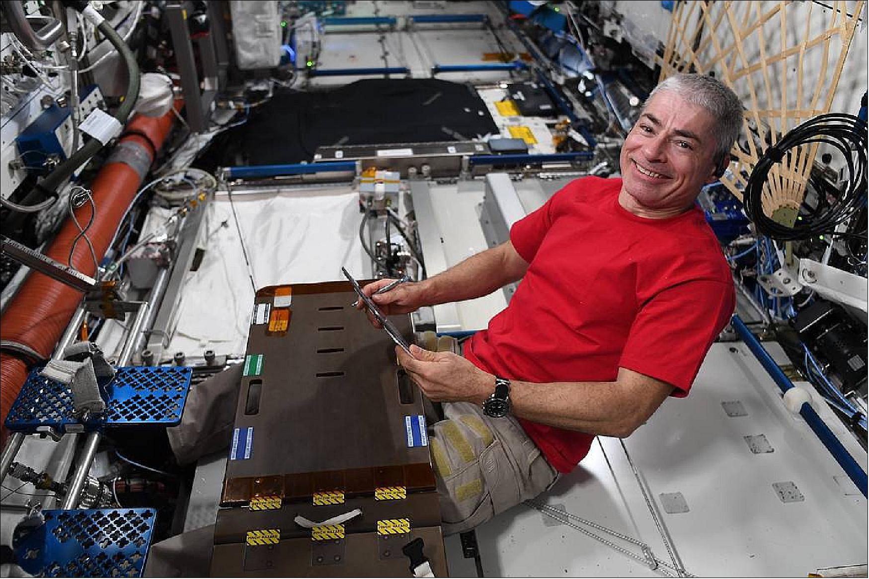 Figure 15: Aboard the International Space Station, NASA astronaut Mark Vande Hei squeezes in time to unwind with a book. Vande Hei made it into record books on Tuesday, March 15, 2022, breaking the record for the most consecutive days in space by an American explorer (image credit: ESA/NASA-T. Pesquet)