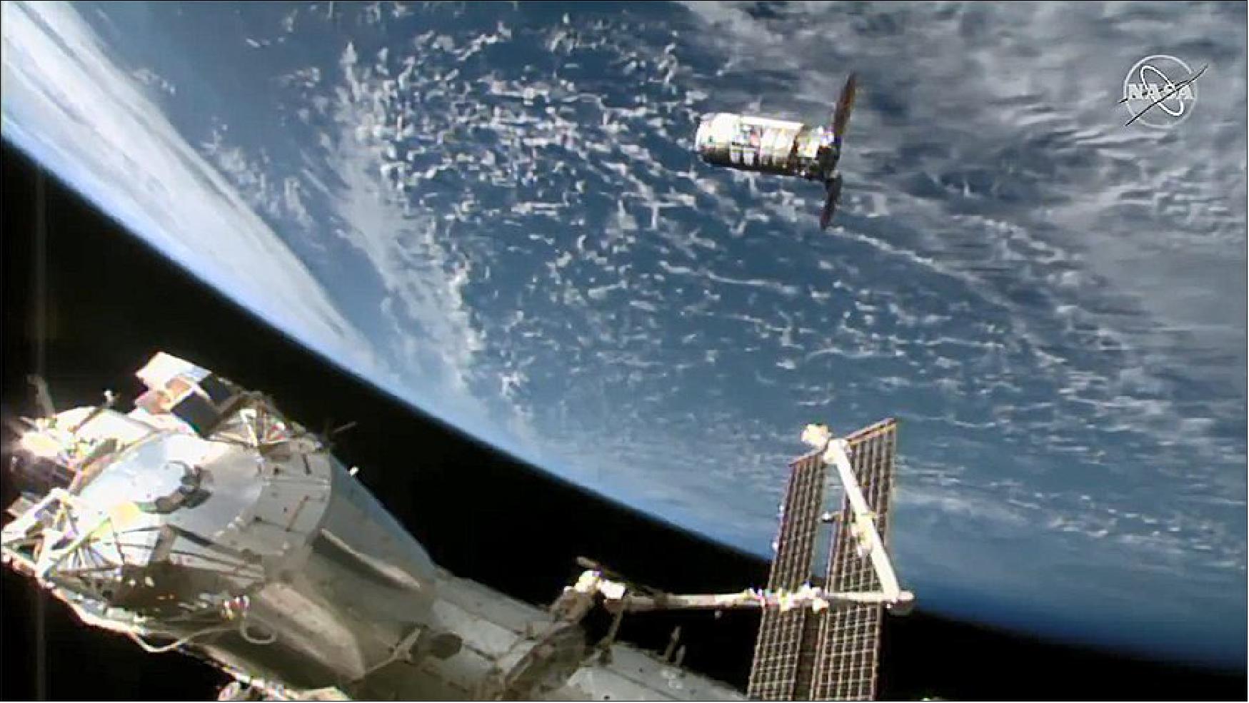 Figure 8: The Northrop Grumman Cygnus-15 resupply ship is pictured about 30 meters away from the space station approaching its capture point near the Canadarm2 robotic arm (image credit: NASA TV)