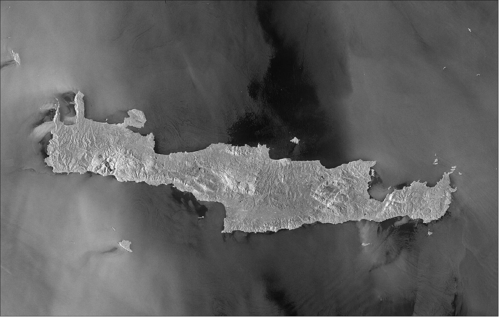 Figure 5: The two identical Copernicus Sentinel-1 satellites carry radar instruments, which can see through clouds and rain, and in the dark, to image Earth’s surface below. The sea surface reflects the radar signal away from the satellite, making water appear dark in the image, while cities on the island are visible in white owing to the strong reflection of the radar signal. This image is also featured on the Earth from Space video program (image credit: ESA, the image contains modified Copernicus Sentinel data (2019), processed by ESA, CC BY-SA 3.0 IGO)