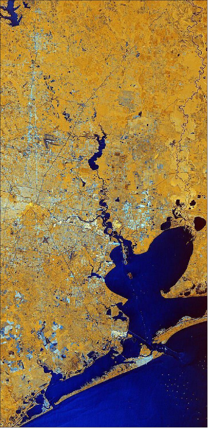 Figure 26: In this composite image, captured on 21 June 2019, the city of Houston appears in shades of white and grey which contrasts with the yellow tones of the surrounding land and the dark blue waters of the Gulf of Mexico. This image is also available in the Earth from Space video program (image credit: ESA, the image contains modified Copernicus Sentinel data (2019), processed by ESA, CC BY-SA 3.0 IGO)