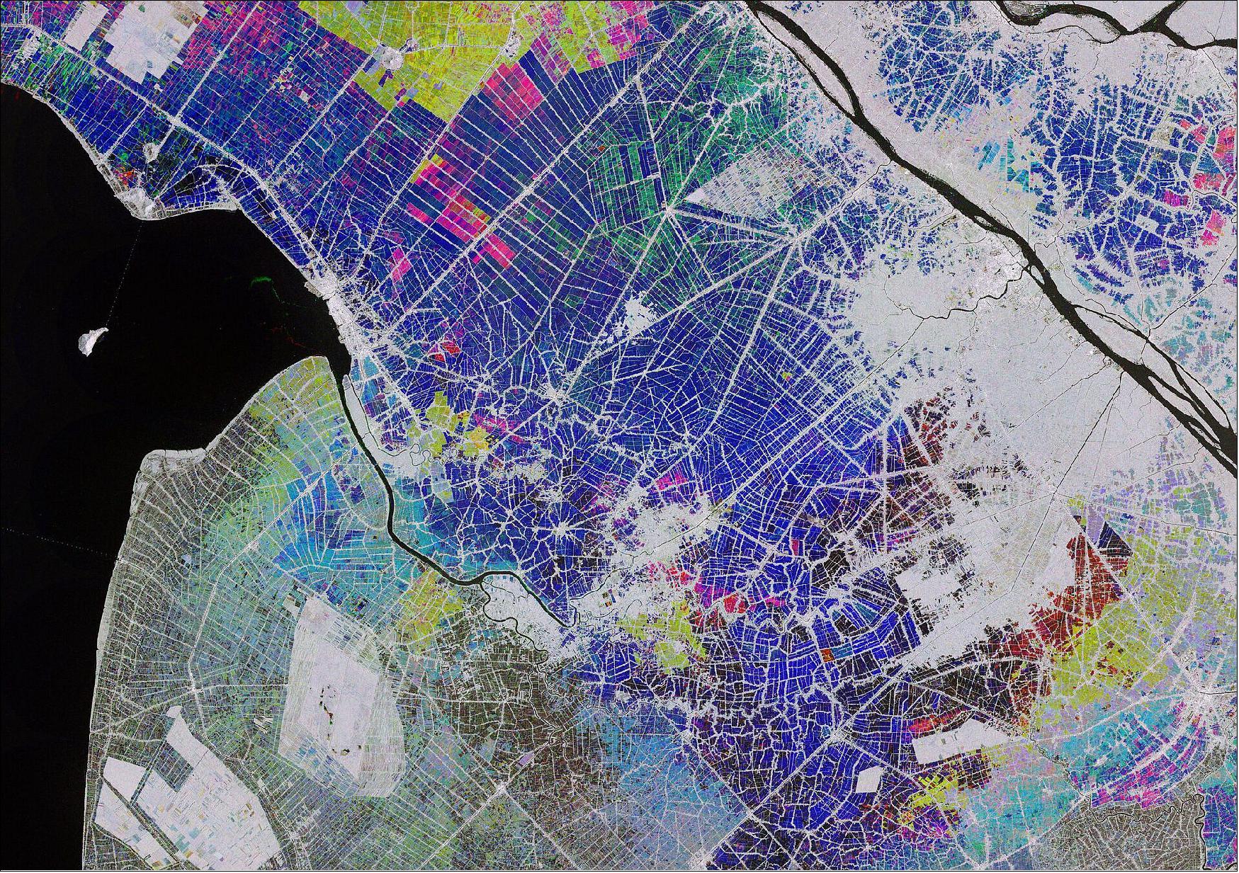 Figure 25: This multi-temporal image combines three radar acquisitions from the Copernicus Sentinel-1 mission taken around one month apart to show changes in crop and land conditions over time. The bright colors in the image come from changes on the ground that have occurred between acquisitions. The first image, from 28 October 2019, picks out changes in pink and red, the second from 21 November shows changes in green, and the third image, from 27 December, shows changes in blue. As seen in the image, the majority of growth in the rice fields is visible in December. The grey areas represent either built-up areas or patches of land that saw no changes during this time. This image is also featured on the Earth from Space video program (image credit: ESA, the image contains modified Copernicus Sentinel data (2019), processed by ESA, CC BY-SA 3.0 IGO)
