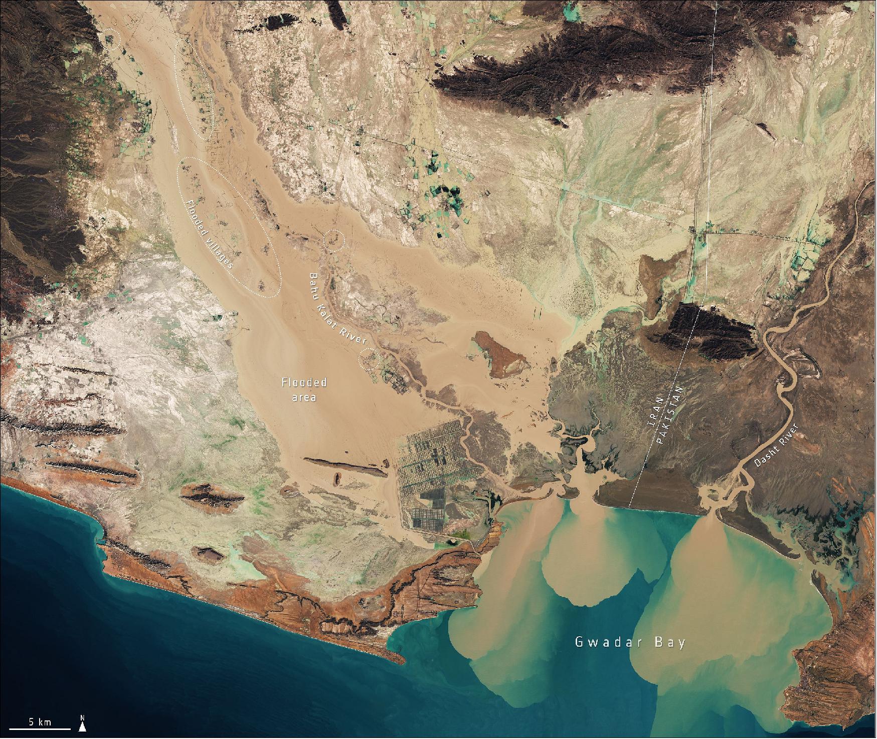 Figure 66: This image, captured by the Copernicus Sentinel-2 mission, shows the extent of the flooding in the Sistan and Baluchestan province on 13 January 2020. Flooded areas are visible in brown, while the flooded villages are highlighted by dotted circles. Sediment and mud, caused by the heavy rains, can be seen gushing from the Bahu Kalat River, Iran, and Dasht River, Pakistan, into Gwadar Bay (image credit: ESA, the image contains modified Copernicus Sentinel data (2020), processed by ESA, CC BY-SA 3.0 IGO)