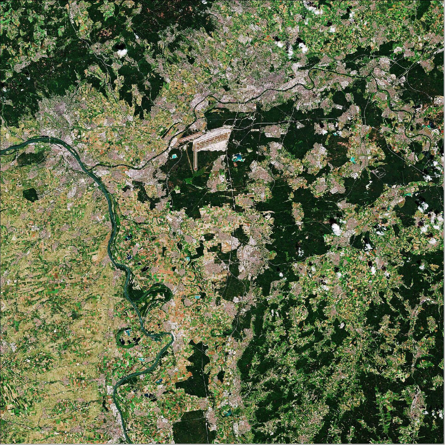 Figure 5: The image pictured here shows the Frankfurt Rhine-Main region in south-central Germany. With a population of almost six million people, the region includes the main cities of Frankfurt, Wiesbaden, Offenbach and Darmstadt. Frankfurt, Germany’s fifth-largest city, is visible at the top of the image, located on both sides of the Main River. The southern part of the city contains the Frankfurt City Forest, the largest inner-city forest in Germany, visible in dark green. Frankfurt Airport can be easily spotted southwest of the city center. This image, captured on 23 June 2020, is also featured on the Earth from Space video program (image credit: ESA, the image contains modified Copernicus Sentinel data (2020), processed by ESA, CC BY-SA 3.0 IGO)