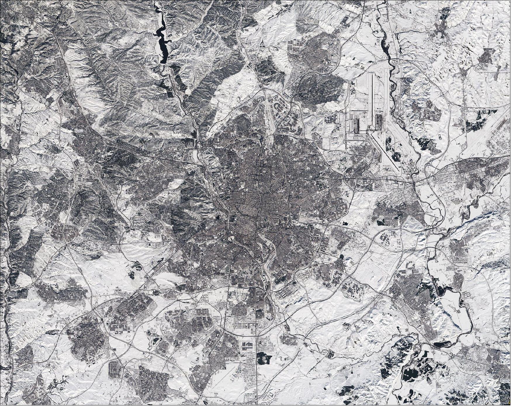 Figure 79: Although this satellite image was taken after the storm had passed, it is clear to see that much snow still remains, especially in the outskirts of the city. For example, some runways at the airport, which is visible in the top-right of the image, are still covered by snow. The unusual cold weather on the Iberian Peninsula is expected to last until later this week with temperatures forecasted to plunge to –12ºC. The race is on to clear roads so that supplies of essential goods such as food supplies and Covid vaccines can be delivered (image credit: ESA, the image contains modified Copernicus Sentinel data (2021), processed by ESA, CC BY-SA 3.0 IGO)