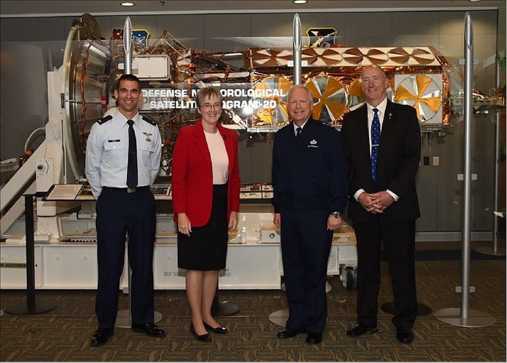 Figure 33: Secretary of the Air Force Heather Wilson and Air Force Lt. Gen. John Thompson, commander of the Space and Missile Systems Center and Program Executive Officer for Space, pose for a photo with Air Force 2nd Lt Zachary Nuss, far left, and Dr. Steven Pluntze, far right, in front of a decommissioned Defense Meteorological Satellite Program 20 satellite during the Space and Missile Systems Center's lecture series, Airmen Everywhere, at Los Angeles Air Force Base in El Segundo, Calif., Dec. 14, 2017. DMSP-20, was dismantled and put in a museum instead of launched (image credit: U.S. Air Force photo/Sarah Corrice)