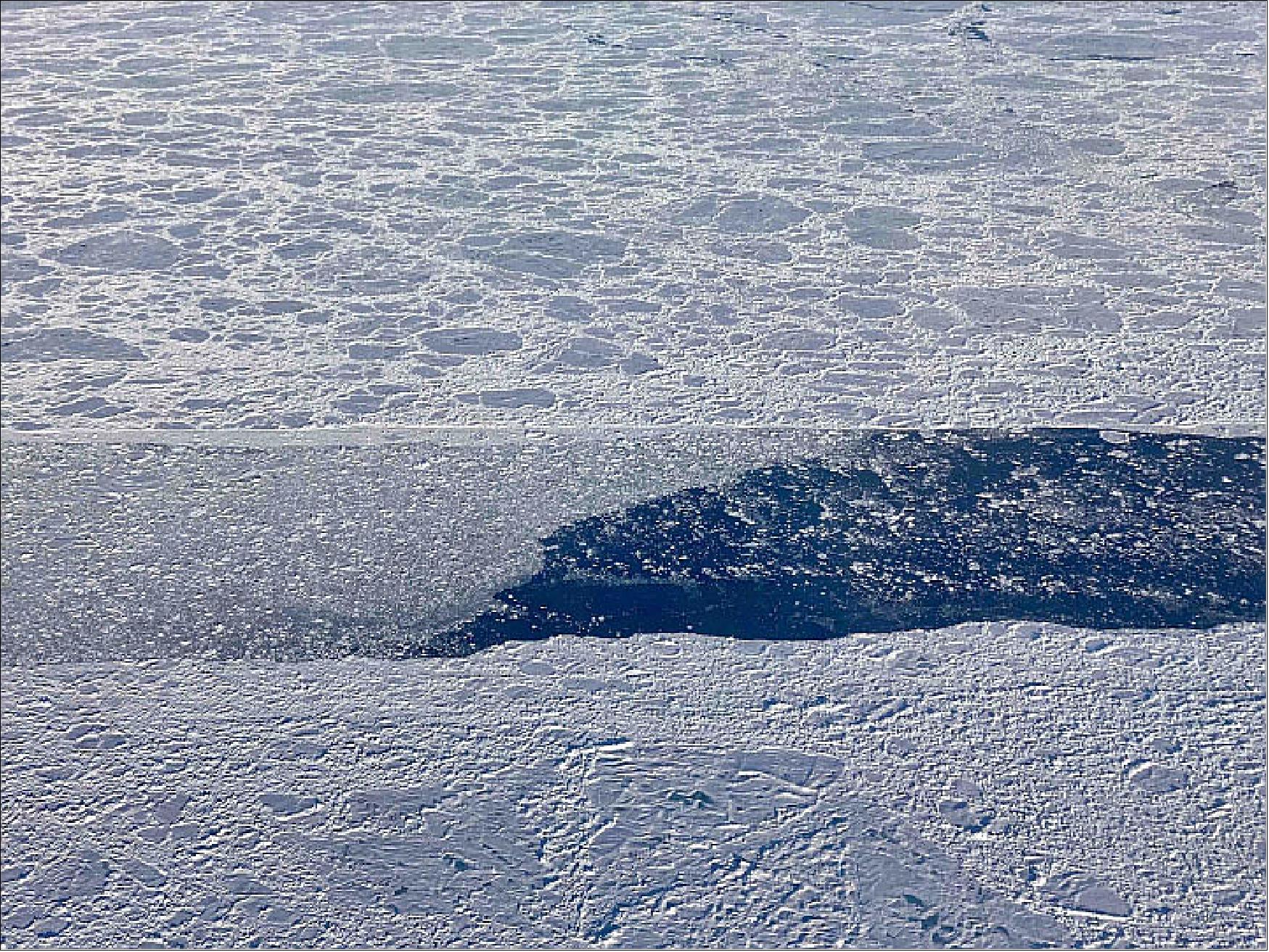 Figure 29: This photo, taken during an Operation IceBridge flight on September 9, 2019, shows an opening in the sea ice cover north of Greenland. The lead is partially filled by much smaller sea ice rubble and floes (image credit: NASA Earth Observatory, photograph by Linette Boisvert. Story by Maria-José Viñas, NASA’s Earth Science News Team)