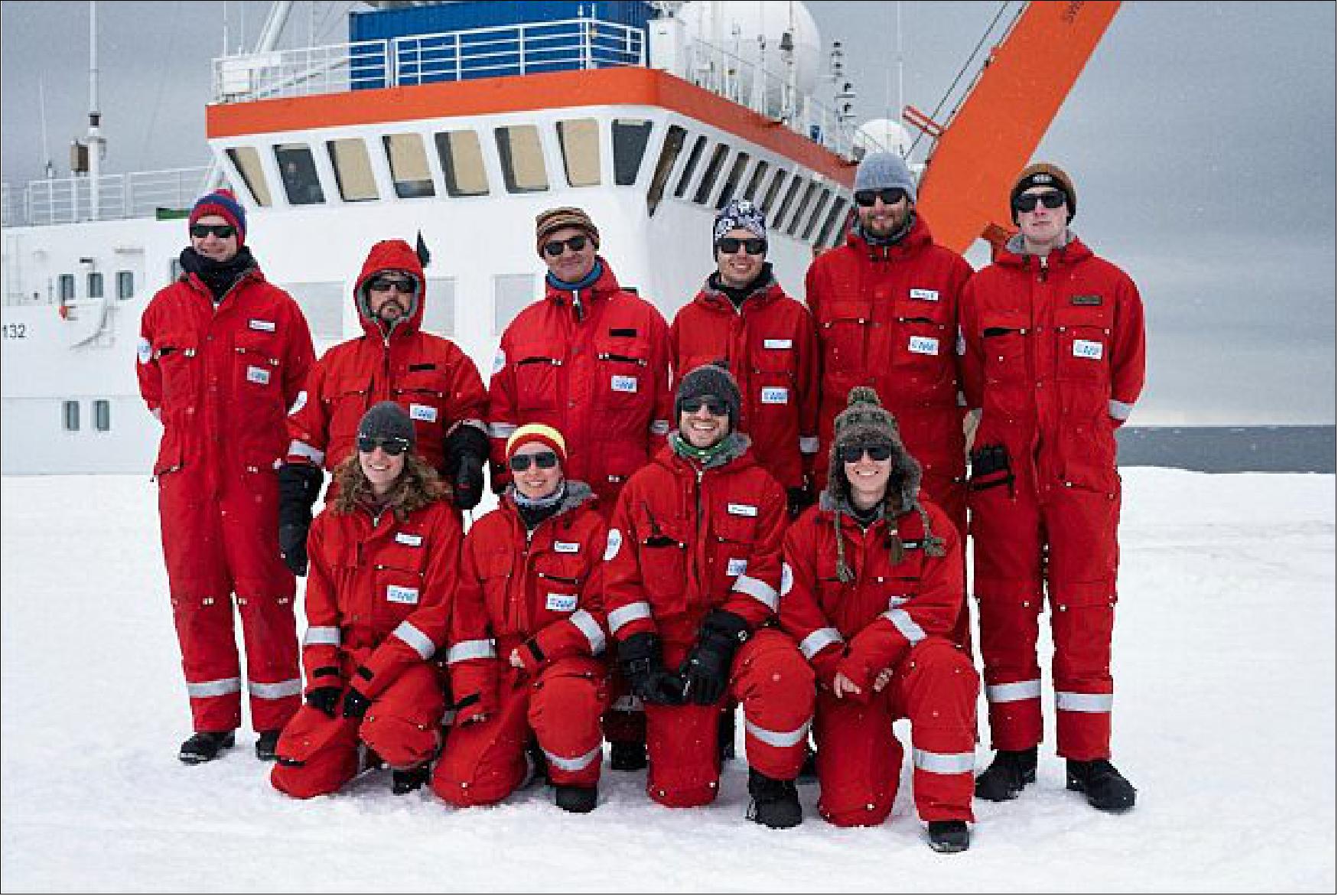 Figure 17: The 2021 overwintering team in front of Polarstern upon arrival in Antarctica. Back row L-R: mechanical engineer Florian Koch, chef Tanguy Doron, station leader and surgeon Peter Jonczyk, meteorologist Paul Ockenfuss, electrical technician Markus Baden, geophysicist Lorenz Marten. Front row L-R: atmospheric chemist Linda Ort, IT and radio specialist Theresa Thoma, geophysicist Timo Dornhoefer, agronomist/astrobotanist Jess Bunchek (image credit: AWI/Tim Heitland)