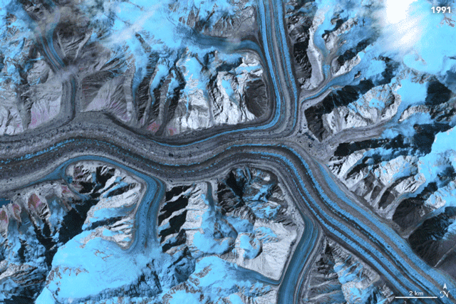 Figure 57: Glacier flow is imperceptible to the human eye, but this animation shows glaciers in Asia moving over a span of 11 years, from 1991 to 2002. The animation is composed of false-color images from Landsat 5 and 7 spacecraft. Moving ice is gray and blue; brighter blues are changing snow and ice cover (image credit: NASA/JPL-Caltech/USGS/Earth Observatory)