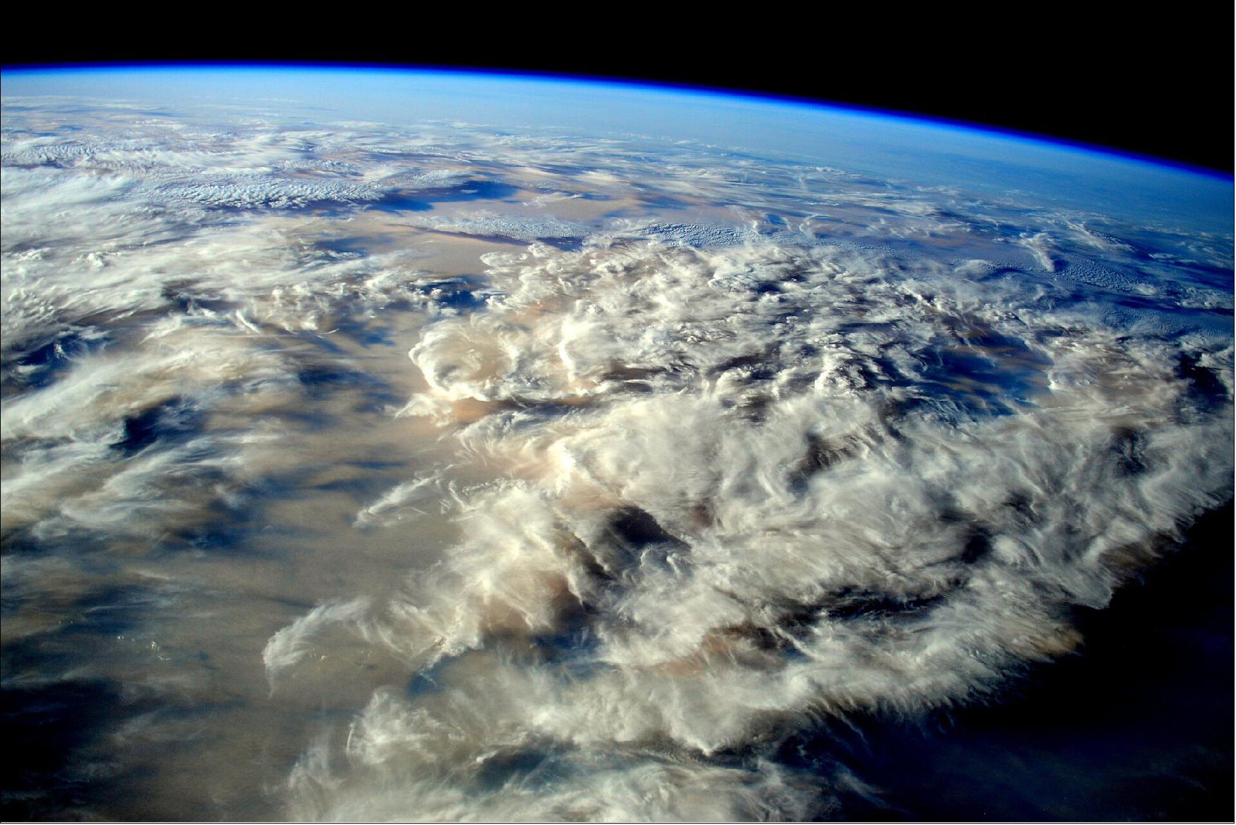 Figure 10: Ecosystem Earth. ESA astronaut Samantha Cristoforetti took this image of our planet from 400 km high on the International Space Station in January 2015. She commented simply: “Good night from space.” The blue haze seen on the curved horizon is our thin atmosphere that provides the air we breathe and protection from space radiation (image credit: ESA/NASA)