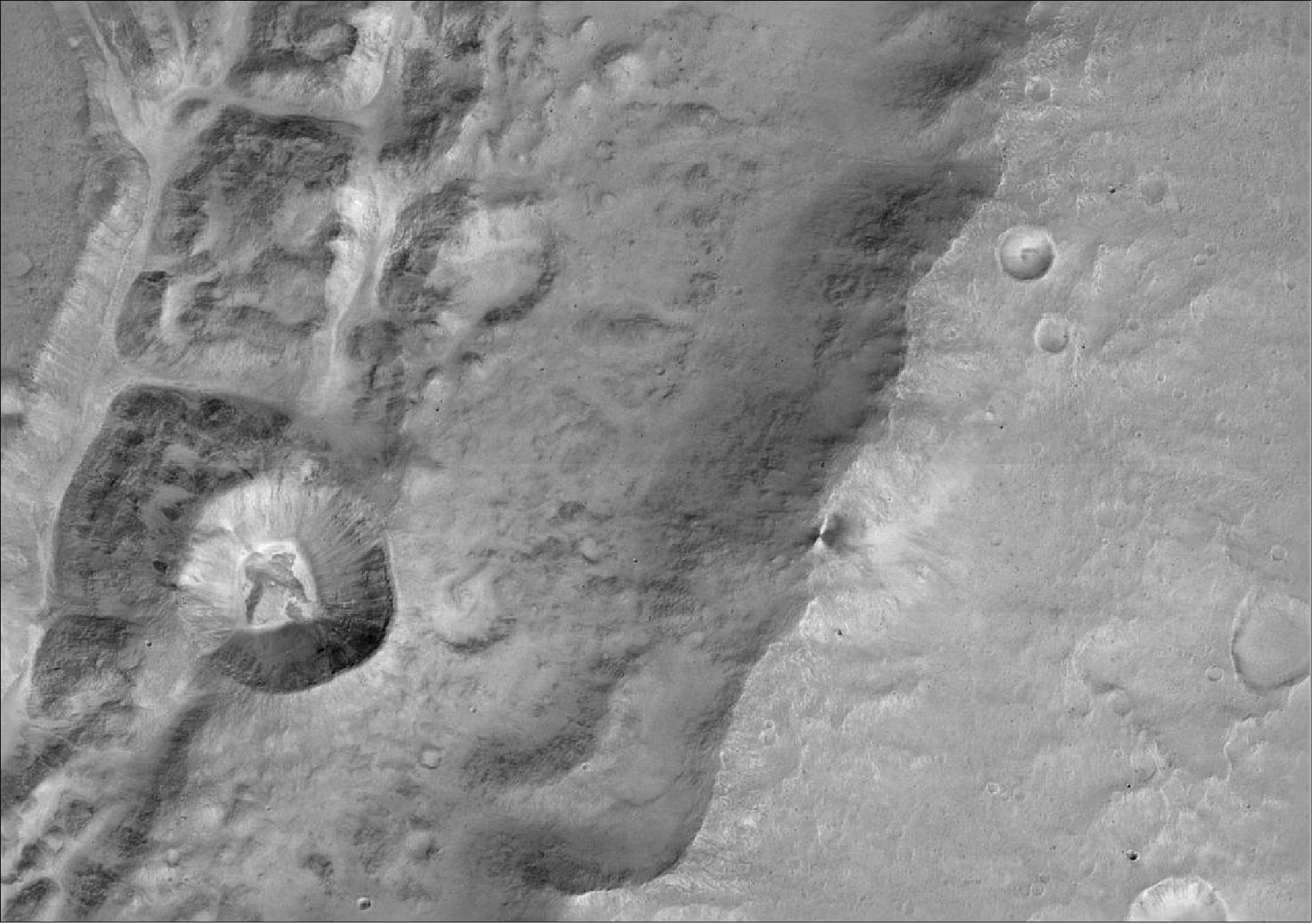 Figure 123: Close-up of the rim of a large unnamed crater north of a crater named Da Vinci, situated near the Mars equator. A smaller, 1.4 km-diameter crater is seen in the rim along the left hand side of the image. The image scale is 7.2 m/pixel. The image was taken on 22 November 2016 and is one of the first acquired by the CaSSIS (Color and Stereo Surface Imaging System) onboard the ExoMars TGO. The image was taken as part of an eight-day campaign to test the science instruments for the first time since arriving at the Red Planet on 19 October (image credit: ESA/Roscosmos/ExoMars/CaSSIS/UniBE)