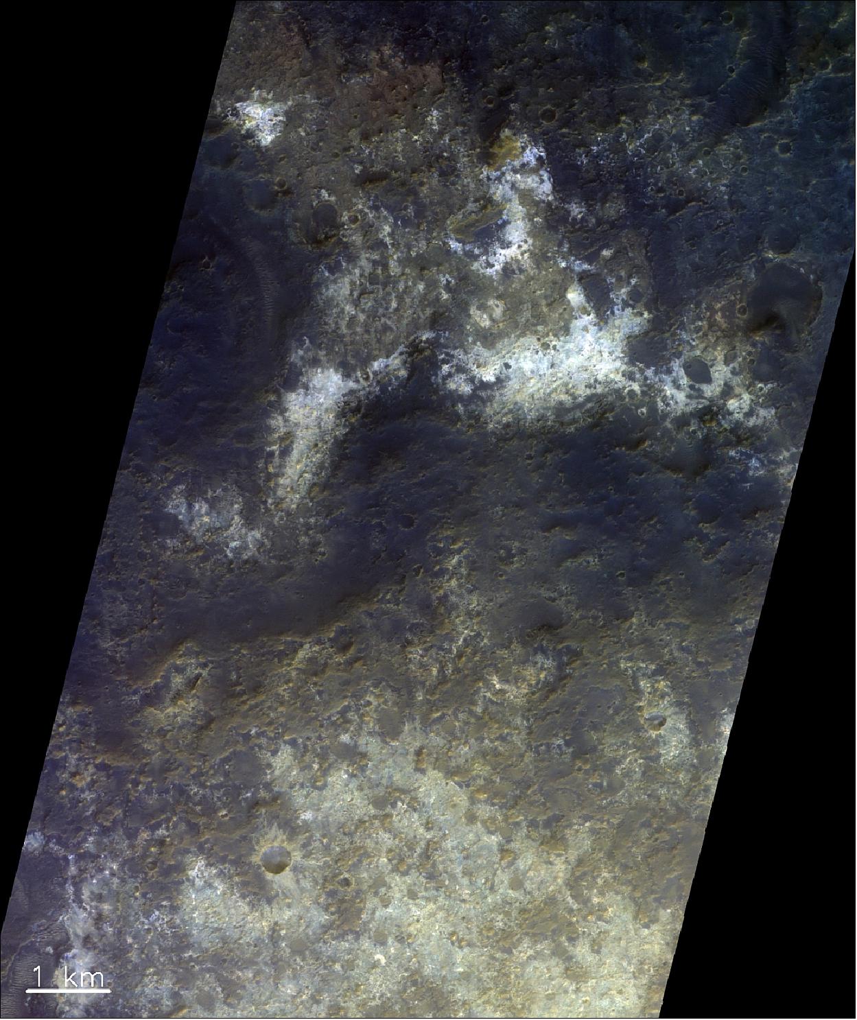 Figure 80: This colorful image of terrain south of the Mawrth Vallis outflow channel on Mars shows the diversity of mineralogical compositions found in this region. The image was taken by the CaSSIS instrument onboard the ESA-Roscosmos ExoMars TGO on 5 January 2019 and is shown as a color-composite that has been processed to better highlight the different compositions. The image is centered at 21.6°N/341.7°E. North is up (image credit: ESA/Roscosmos/CaSSIS, CC BY-SA 3.0 IGO)