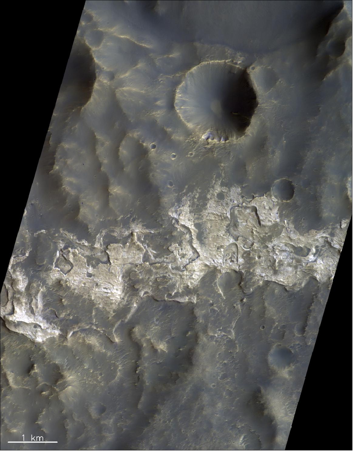 Figure 76: This image covers a portion of the wall-terrace region of the 100 km-wide Columbus Crater located within Terra Sirenum in the southern hemisphere of Mars. The image was taken by the CaSSIS instrument onboard the ESA-Roscosmos ExoMars TGO on 15 January 2019. The image is centered at 28.79ºS/193.84ºE. North is up (image credit: ESA/Roscosmos/CaSSIS, CC BY-SA 3.0 IGO)