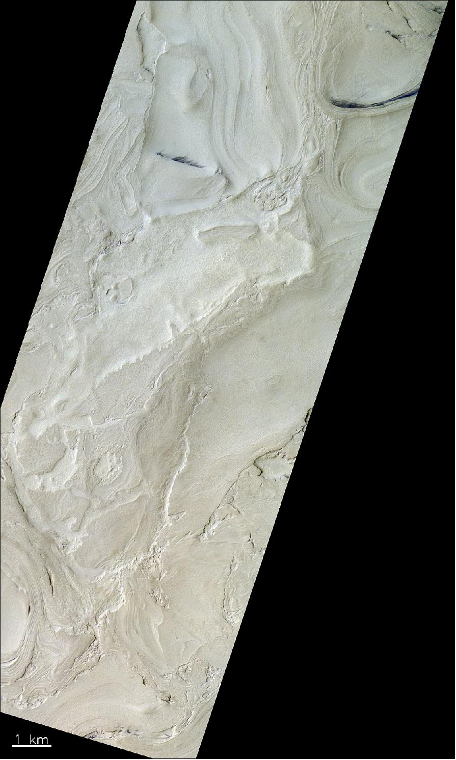 Figure 74: This image captures a landform on Mars peculiar to the Hellas Basin, sometimes referred to as ‘banded terrain’. The pictured area belongs to the western part of the basin, which contains the lowest lying surfaces on Mars – up to 7 km below the defined zero level. The image was taken by the CaSSIS instrument onboard the ESA-Roscosmos ExoMars TGO on 12 December 2018. It is centered at 39.04ºS/53.9ºE (image credit: ESA/Roscosmos/CaSSIS, CC BY-SA 3.0 IGO)