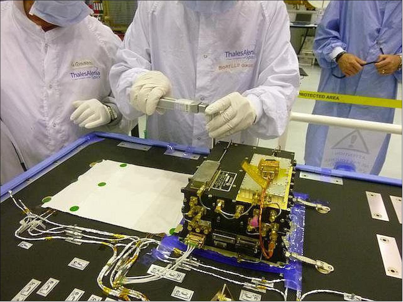 Figure 2: This image shows a step in installation and testing of the first of the orbiter's Electra radios, inside a clean room at Thales Alenia Space, in Cannes, France, in June 2014 (image credit: NASA/JPL-Caltech/ESA/TAS) 10)