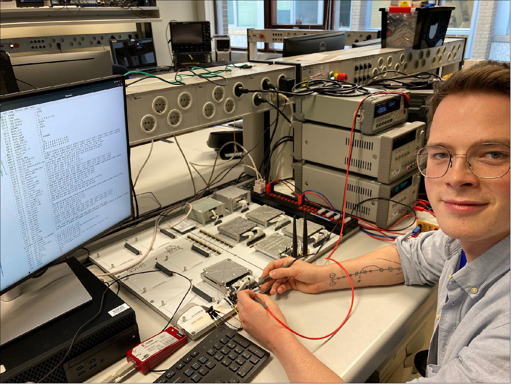 Figure 2: ESA Young Graduate Trainee Malte Bargholz with the FlatSat he has been working on a resource for testing CubeSat elements as part of his work with the On-Board Computer and Data Handling section at ESTEC in the Netherlands (image credit: ESA)