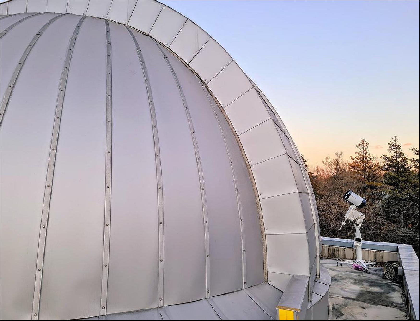 Figure 19: NICT's optical ground station with its 20 cm telescope (right) and the dome for its one-meter telescope (image credit: NICT)