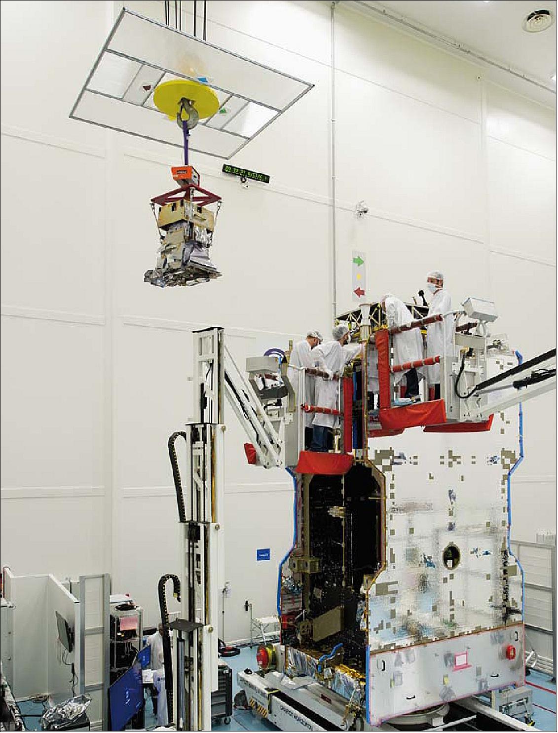 Figure 7: The GOLD instrument is hoisted up and installed onto the SES-14 commercial communications satellite, which is being assembled at Airbus Defence and Space in Toulouse, France (image credit: Airbus DS)