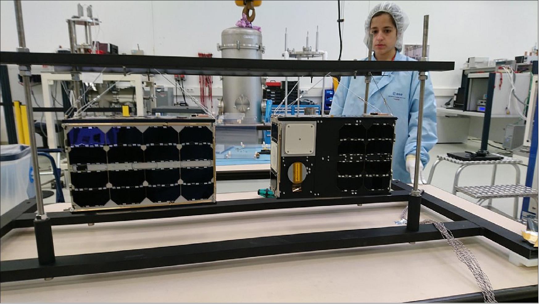 Figure 6: This photo depicts the two GOMX-4 satellites in the test facilities of ESA/ESTEC about to undergo thermal–vacuum testing (image credit: ESA, GomSpace)