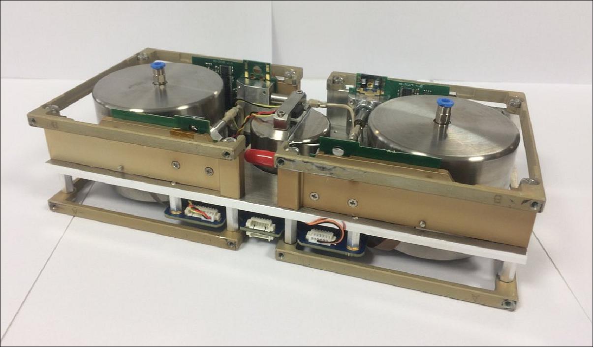Figure 21: GomX-4B’s cold-gas thruster system takes up two half-CubeSat units at one side of the nanosatellite, with two spherical titanium tanks filled with liquid butane. It has four 1 mN thrusters, typically to be fired in pairs while keeping one set in reserve (image credit: NanoSpace)