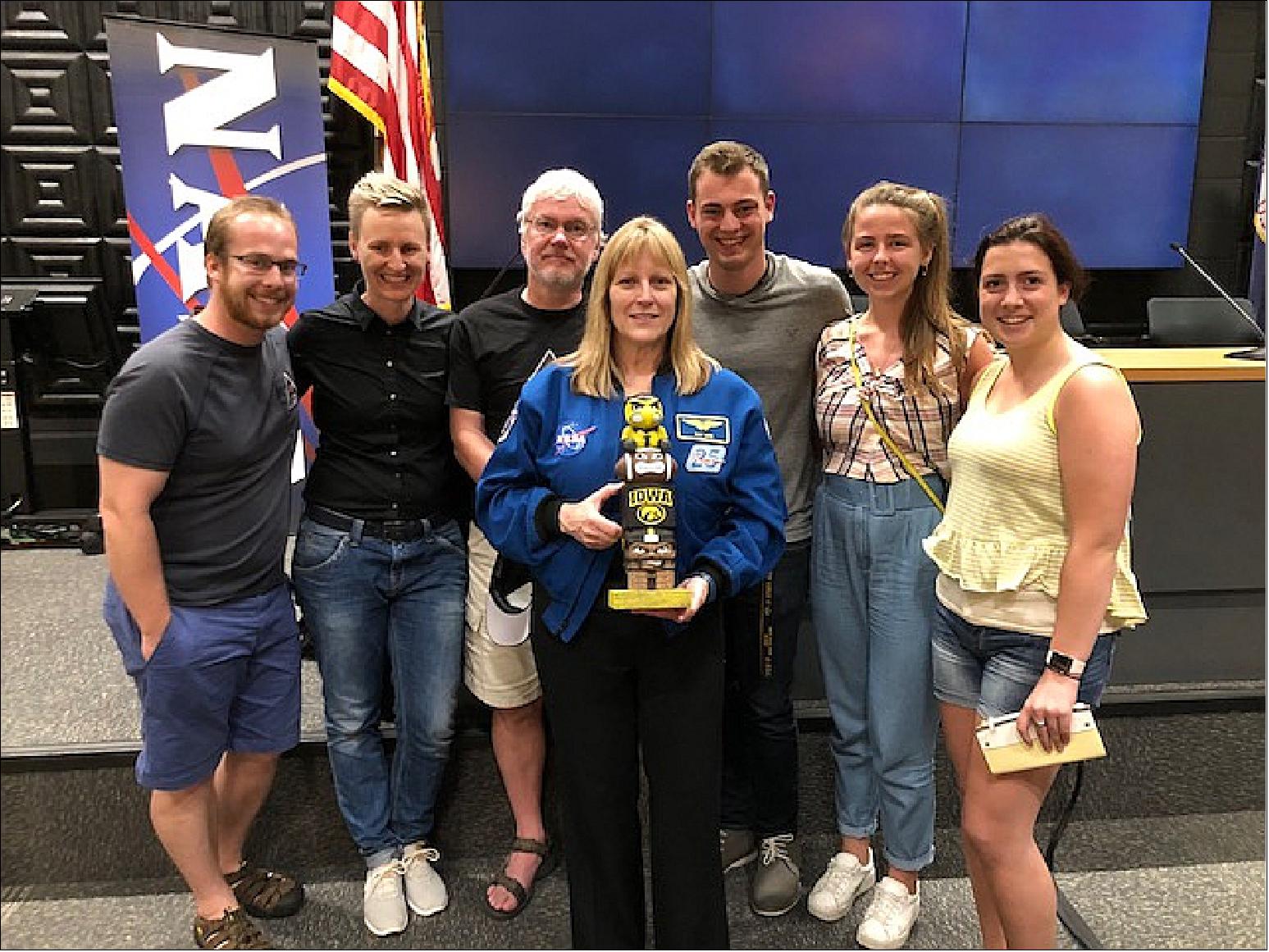 Figure 9: The University of Iowa HaloSat team attended the satellite’s launch at NASA’s Wallops Flight Facility. From left to right: Daniel LaRocca, Anna Zajczjk, Philip Kaaret, William Fuelberth, Hannah Gulick and Emily Silich. Kay Hire (center) holds the University of Iowa’s tiki totem statue (image credit: Alexis Durow, Ref. 27)