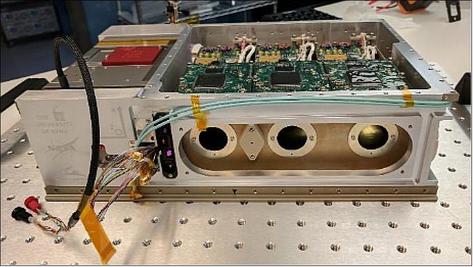 Figure 3: Science instrument integrated with the avionics in the flight bus chassis. PCBs for analog electronics and DPUs are on the top of instrument chassis with the alignment washers and a cover over the optical alignment mirror at the front. The XB1 bus is on the left. The solar array had not been attached at this point in the integration (image credit: BCT, University of Iowa)