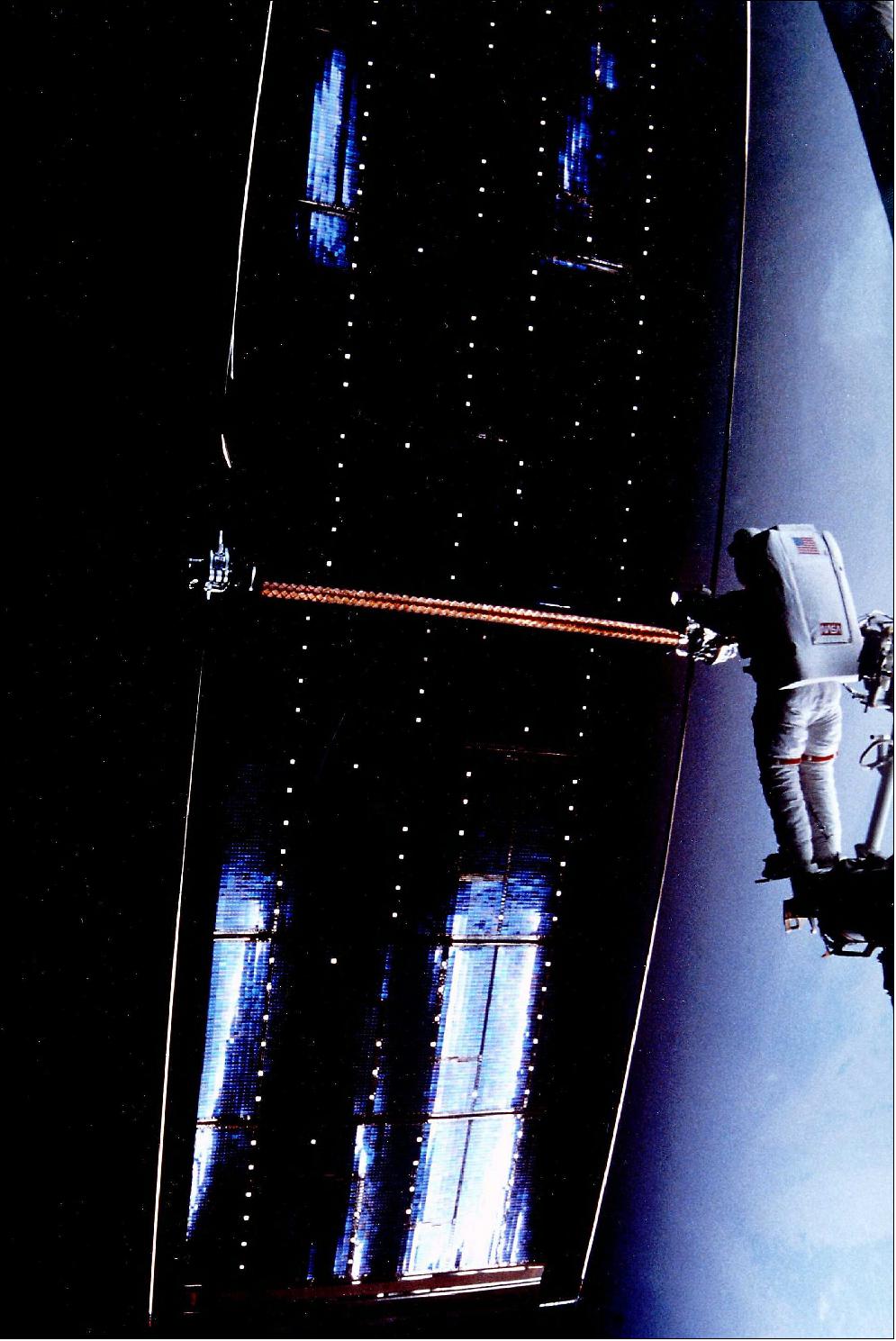 Figure 63: Astronaut Kathy Thornton threw the damaged Hubble array into free space once it became clear its failed compensation mechanism had bent it into a bow-like shape, making refurling for return to Earth at the end of STS-61 on Servicing Mission in December 1993 impossible (image credit: NASA)