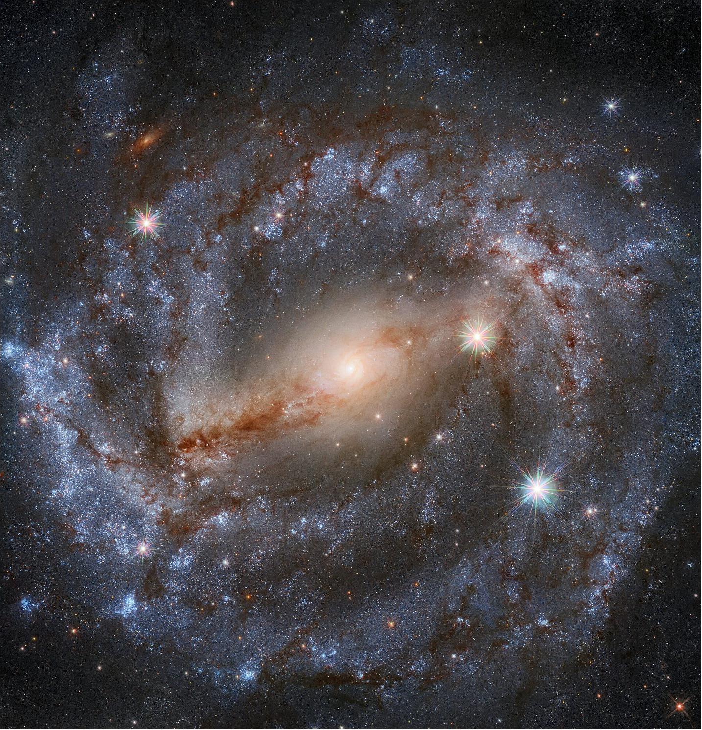 Figure 23: This stunning image by the NASA/ESA Hubble Space Telescope features the spiral galaxy NGC 5643 in the constellation of Lupus (The Wolf). Looking this good isn’t easy; thirty different exposures, for a total of 9 hours observation time, together with the high resolution and clarity of Hubble, were needed to produce an image of such high level of detail and of beauty (image credit: ESA/Hubble & NASA, A. Riess et al.; CC BY 4.0; Acknowledgement: Mahdi Zamani)